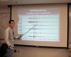 image of seismologist presenting waveforms of CMAB Geophone