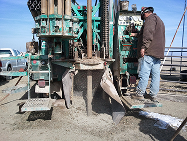 Photo of drill boring into ground